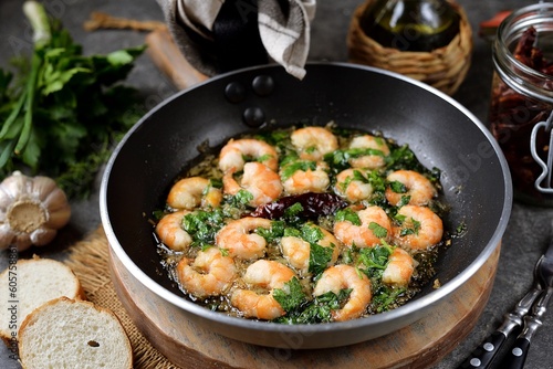 Shrimps fried in olive oil with garlic, hot dry pepper and parsley.