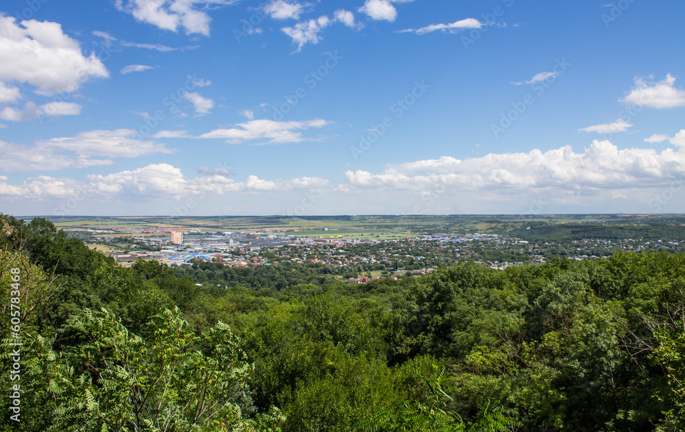 Panoramic top view of the city of Pyatigorsk in Russia on a cloudy summer day and a copy space on the horizon Panoramic top view of the city of Pyatigorsk in Russia on a cloudy summer day and a copy space on the horizon