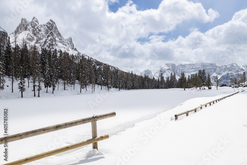 View of Lake Antorno completed frozen in a snowy winter day; Auronzo di Cadore, Dolomites, Italy