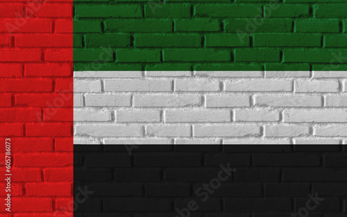 United Arab Emirates country national flag painting on old brick textured wall with cracks and concrete concept 3d rendering image realistic background banner