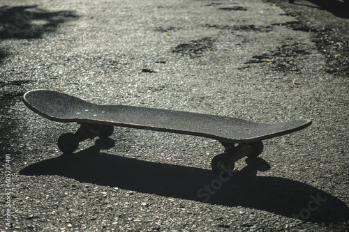 skateboard and skateboard shadow on the ground on a sunny day