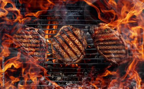 top view of the grill, juicy steaks are fried on the grill photo