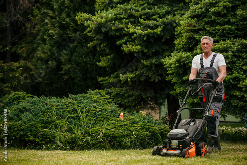 Fotografie Senior male worker working in his backyard.