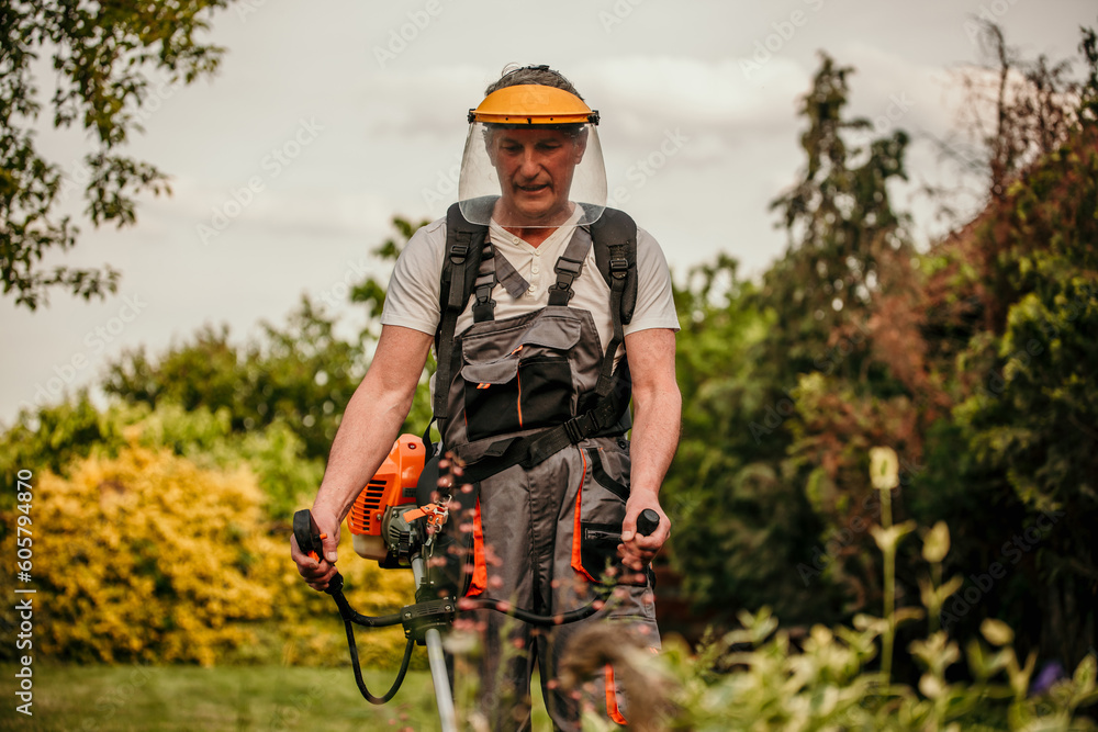 Man cutting the grass with power mower Man cutting the grass with power mower