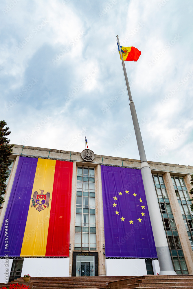 Large flags of the Republic of Moldova and the European Union on the building of the government of Moldova on the eve of the summit of the European Political Community