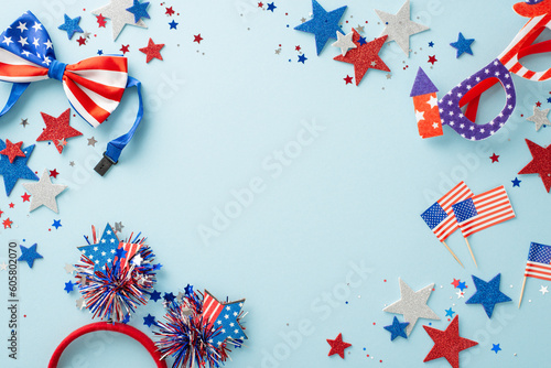 Celebrate USA's Independence Day in style with top view party essentials like glitter stars, sparkle confetti, eyeglasses and more. Pastel blue backdrop offers empty frame perfect for text or advert