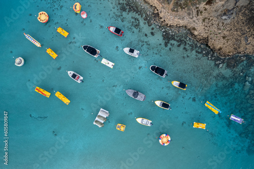 Aerial drone photograph of watersport boats moored anchored at the sea. Summer holidays