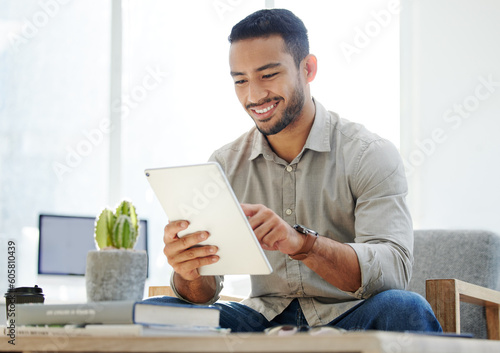 Business man, tablet and email of a web analyst checking online research with a smile. Office chair, technology and employee with social media scrolling and typing on a internet app while reading