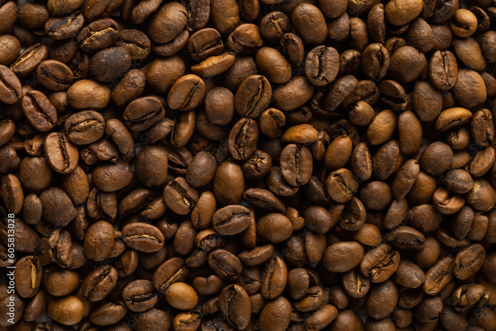 Naklejka premium coffee beans on a white background laid out in the shape of a frame