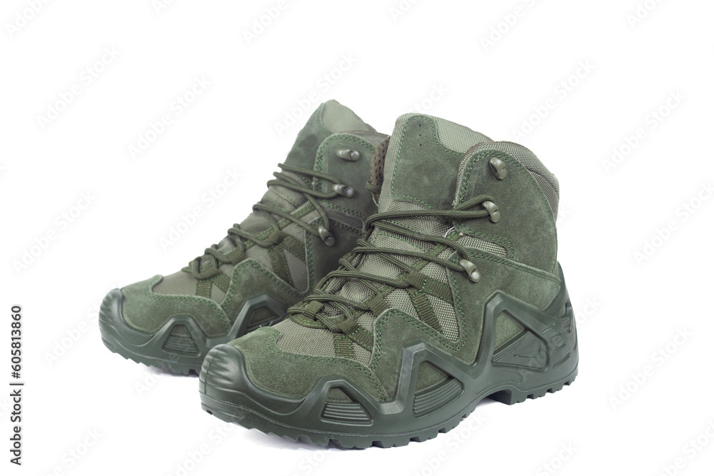Tactical military boots for the army are cut out on a white background. Isolated on a white background, no shadow. Tactical military boots for the army are cut out on a white background. Isolated on a white background, no shadow.