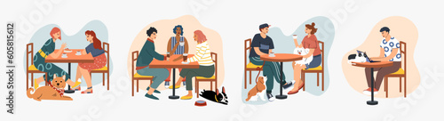 People eat and talk together with a dog and a cat in a cafe. Pet friendly cafe concept.