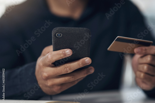 Phone, credit card and man hands for online shopping, e commerce or fintech payment for business discount. Typing, loan and person or entrepreneur for internet banking, mobile app and web transaction © Norman L/peopleimages.com