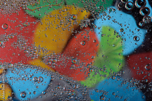 Abstract photography. Color spots are red, blue, yellow, green, black, white, silvery. Drops, objects on the surface. Photos for the background, for design, for interior design.