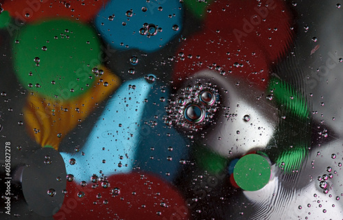 Abstract photography. Color spots are red, blue, yellow, green, black, white, silvery. Drops, objects on the surface. Photos for the background, for design, for interior design.