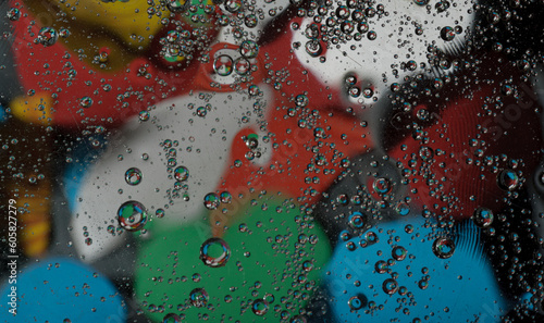 Abstract photography. Color spots are red, blue, yellow, green, black, white, silvery. Drops, objects on the surface. Photos for the background, for design, for interior design.