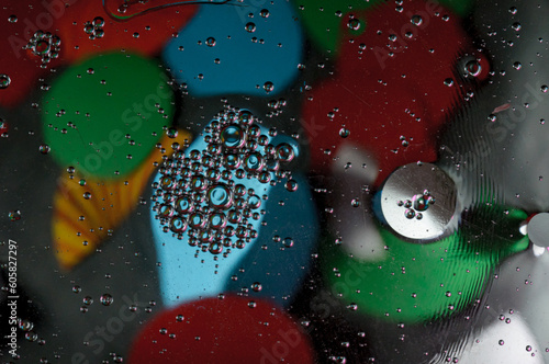 Abstract photography. Color spots are red, blue, yellow, green, black, white, silvery. Drops, objects on the surface. Photos for the background, for design, for interior design.
