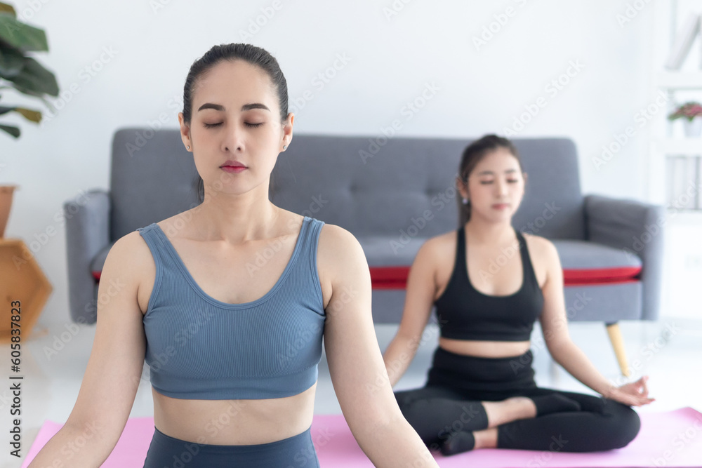 Two women doing yoga, Mindful meditation concept