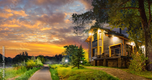 A wooden cottage with a gre...
