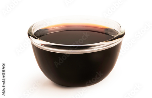 Soy sauce in glass bowl isolated on white background.