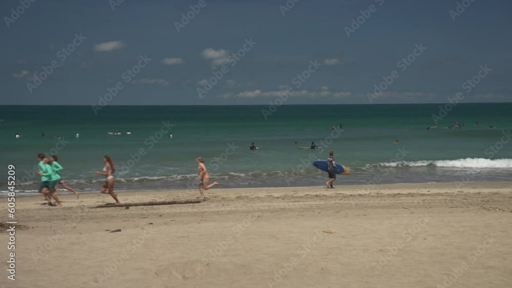 People on Kuta Beach in the morning, Kuta, Bali, Indonesia, South East Asia People on Kuta Beach in the morning, Kuta, Bali, Indonesia, South East Asia