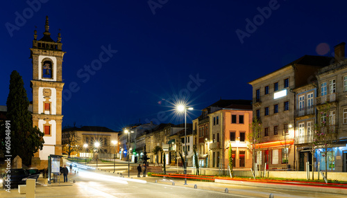 Scenic view of Portuguese town of Vila Real with medieval houses and Cathedral at main Carvalho Araujo avenue at night photo