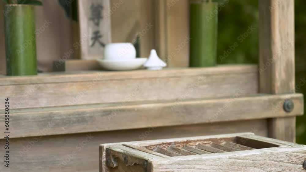 Hand making a offering in wooden offering box or Saisen Box, in Japanese Temple, Kyoto, Japan. Hand making a offering in wooden offering box or Saisen Box, in Japanese Temple, Kyoto, Japan.
