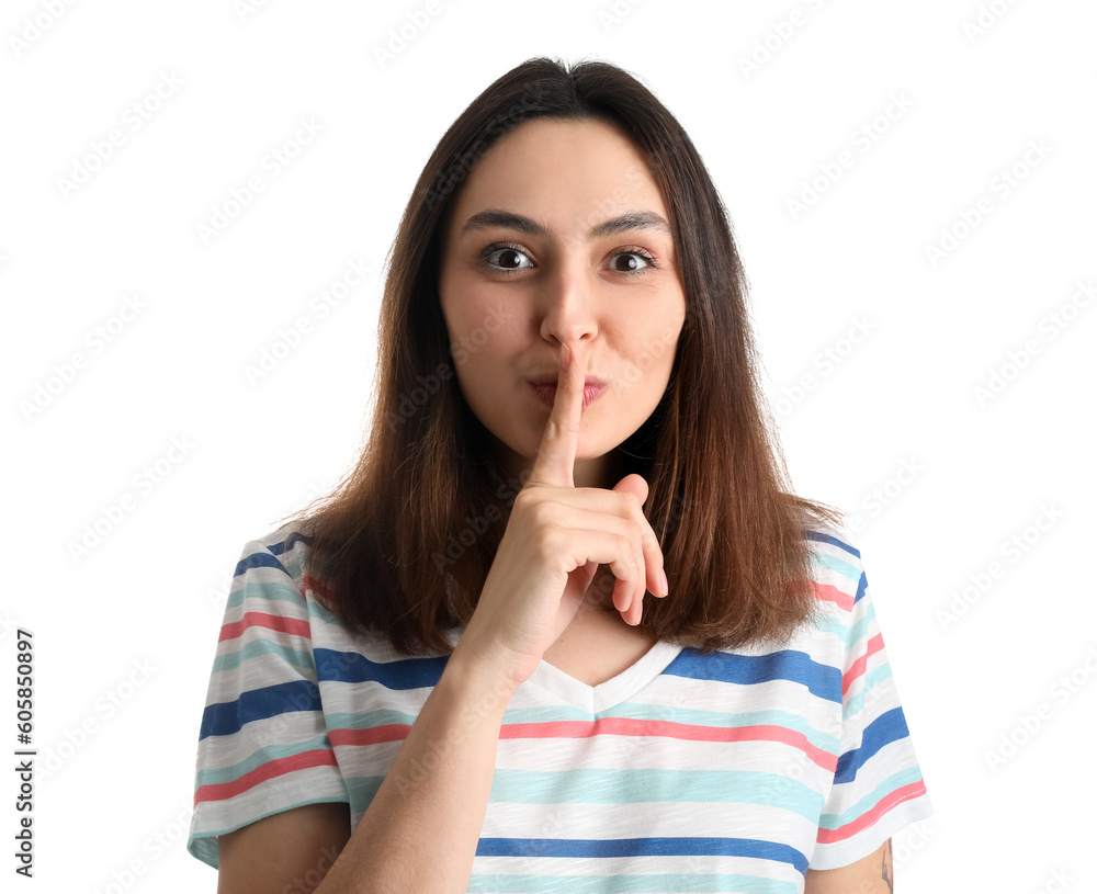 Young woman showing silence gesture on white background, closeup Young woman showing silence gesture on white background, closeup