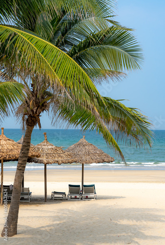 Umbrellas for tourists on the white sand beach at Da Nang city beach  Quang Nam Province  Vietnam