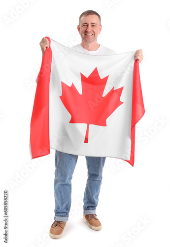 Mature man with flag of Can...