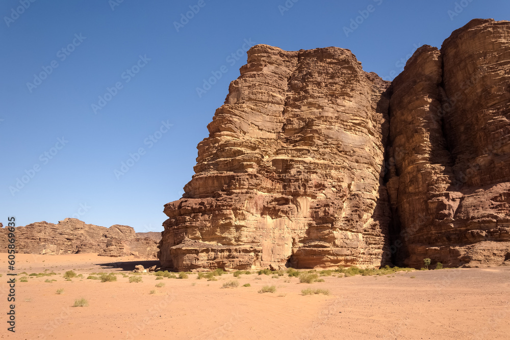 Fototapeta premium Wadi Rum (Valley of the Moon) red sand dunes, sandstone and granite rock view in southern Jordan. Wadi Rum Protected Area was named a UNESCO World Heritage Site in 2011