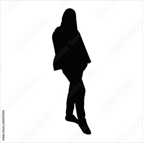 silhouette of a veiled Muslim woman standing with her feet forward
