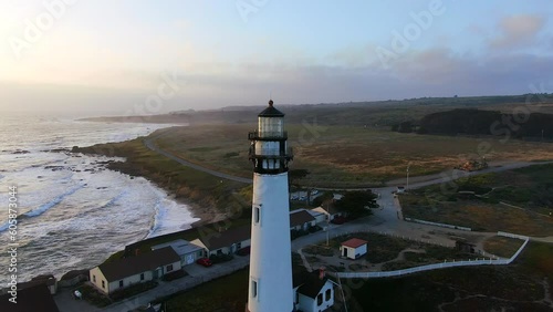 Lighthouse Pigeon Point sunset aerial Cinematic drone coastline wave crashing Santa Cruz Half Moon Bay Davenport Big Sur coastal Highway 1 California deep blue ocean spring forward motion photo