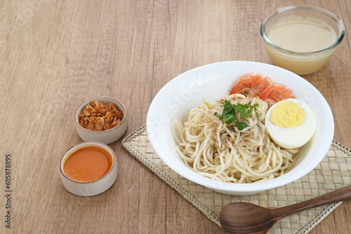 Mie Celor, a noodle dish from Palembang, South Sumatra, Indonesia. Served in a thick and savory shrimp broth with complements such as eggs, shrimp, bean sprouts, and celery.
 photo