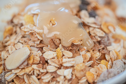 Organic fresh honey with cereal for breakfast photo