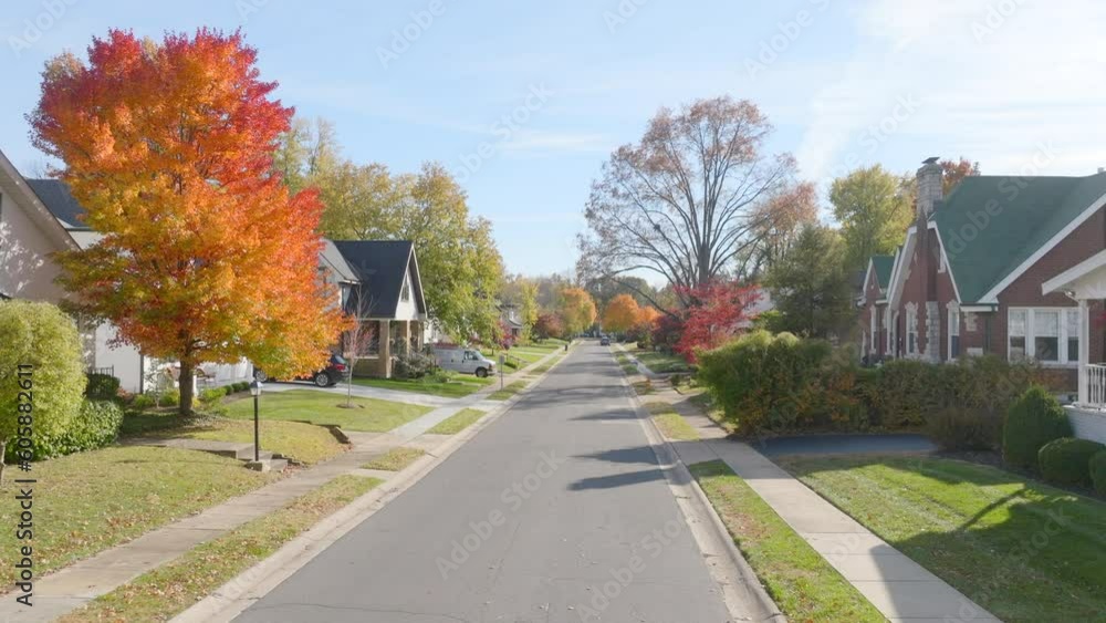 Pull back over a street in a nice quiet neighborhood in St. Louis, Missouri on a beautiful Fall day. Pull back over a street in a nice quiet neighborhood in St. Louis, Missouri on a beautiful Fall day.