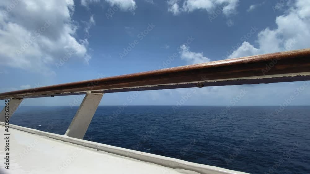Railing of a cruise ship balcony overlooking the ocean Railing of a cruise ship balcony overlooking the ocean