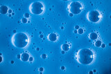 Bubble blue background texture. Berry gel to cleanse the skin of the face and body. Spa treatments, skin care. Bath foam, detergent. Slime blue