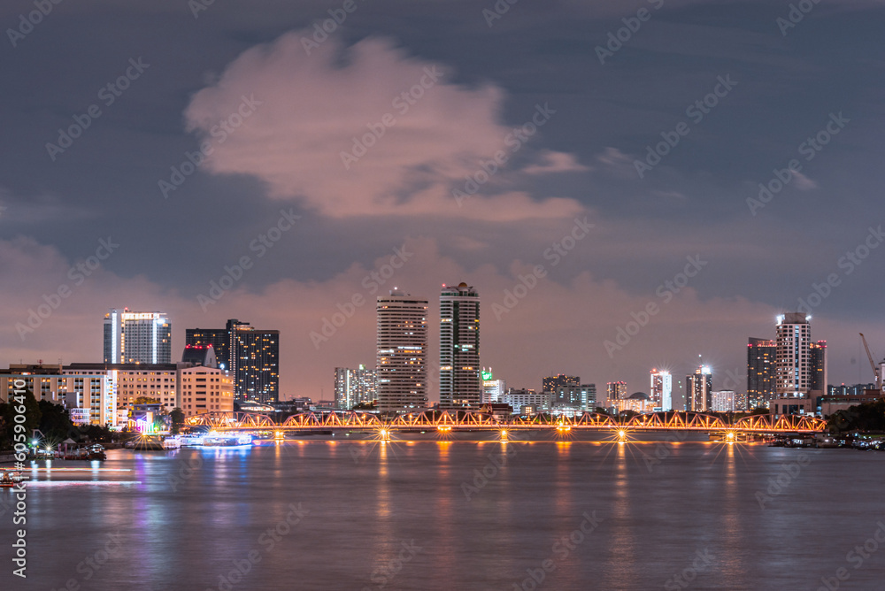 Fototapeta premium Long exposure night land scape at rama VIII bridge, the famous suspension bridge in Thailand , Bangkok, Thailand