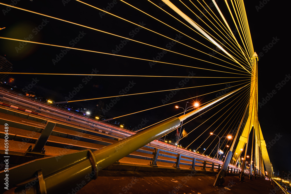Obraz premium Long exposure night land scape at rama VIII bridge, the famous suspension bridge in Thailand , Bangkok, Thailand