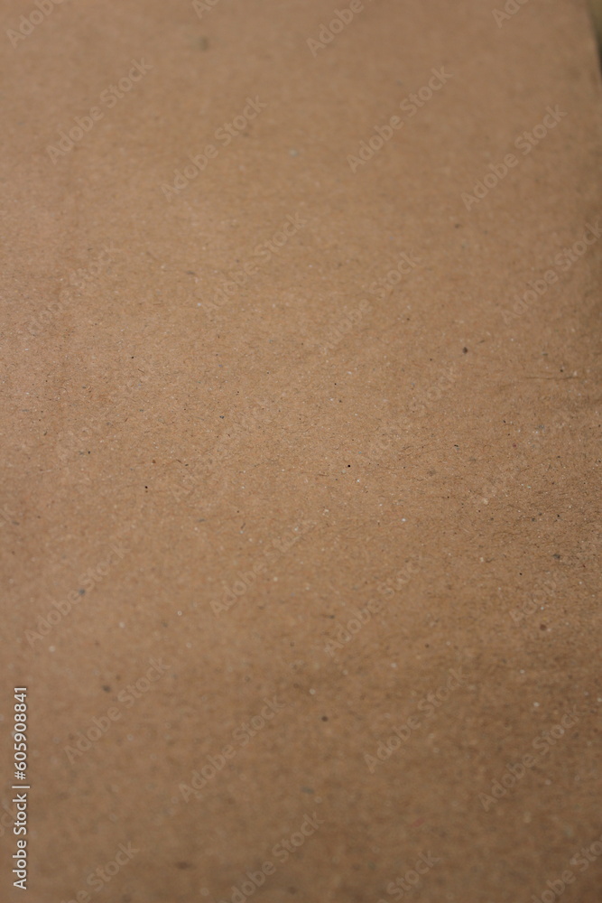 Brown paper texture close detailed background, shiny brown paper surface Brown paper texture close detailed background, shiny brown paper surface