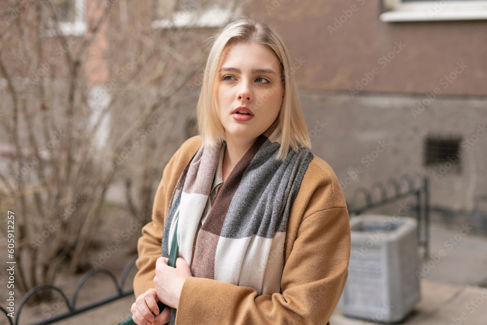 Portrait of the young girl near the building. Lifestyle. Gen Z.