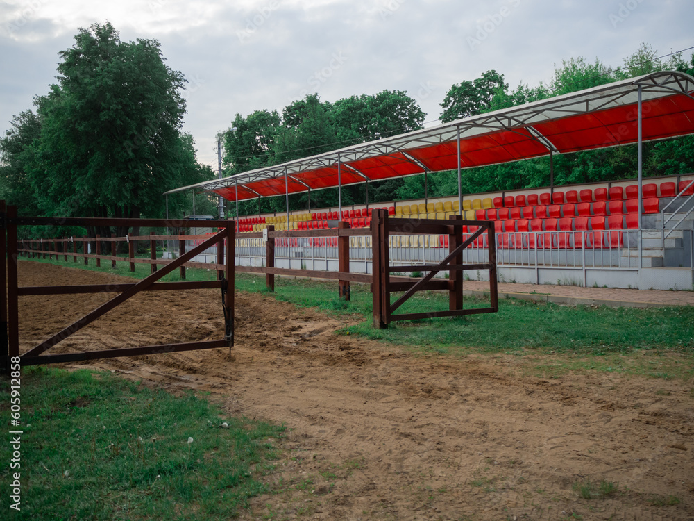 the gates of the racetrack. empty rows for fans.