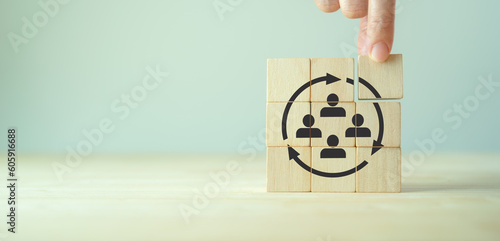 Manpower planning and management concept. Forecasting future staffing needs, analyzing current staffing levels and developing human resource strategies. Wooden blocks with manpower or staffs icons.