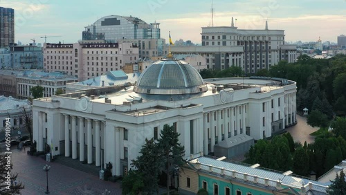 Kiev cityscape with Verkhovna Rada parliament building. Waving ukrainian flag. photo