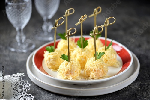 Appetizer of cheese balls on bamboo skewers