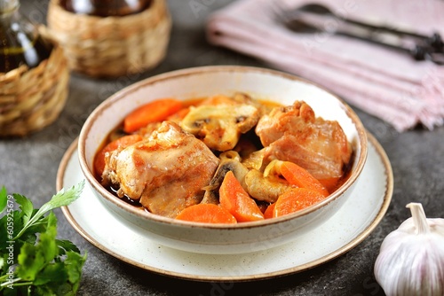 Braised rabbit with carrots, mushrooms, onions and smoked paprika.