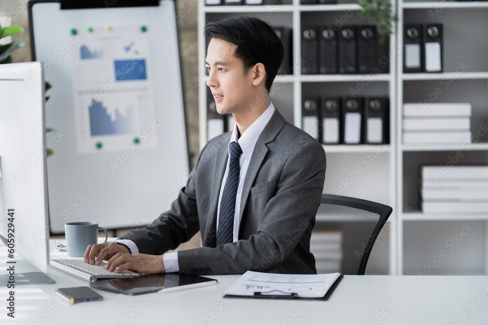 Business man working at office with laptop and documents on his desk, financial adviser analyzing data. Business man working at office with laptop and documents on his desk, financial adviser analyzing data.