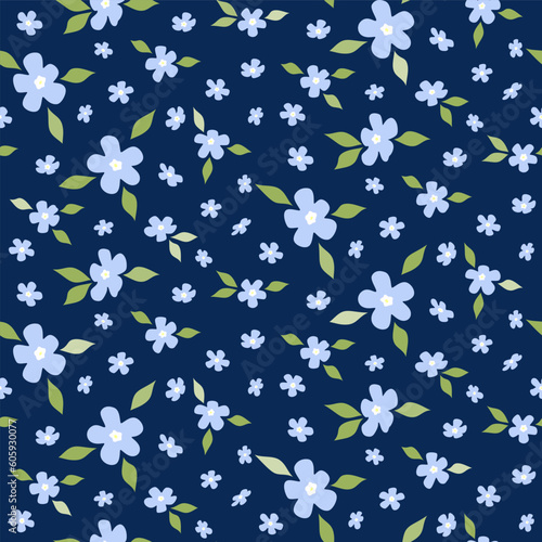 Seamless pattern of small blue flowers and green leaves on navy background. Floral print
