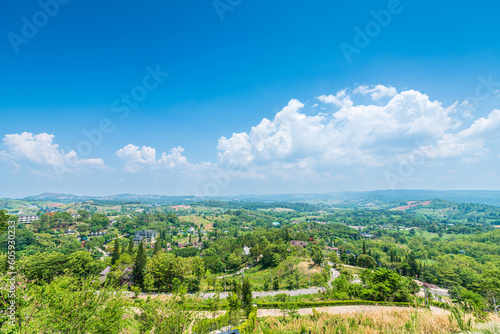 Panoramic high view mountain range on Nature Trail in Khao Kho National Park in Phetchabun,Thailand, blue sky background texture with white clouds