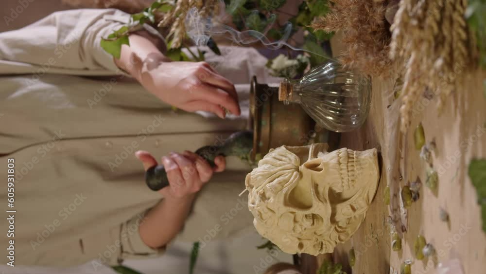 Witch Doing Rituals A vertical shot of a woman performing occult rituals. Occult and ...